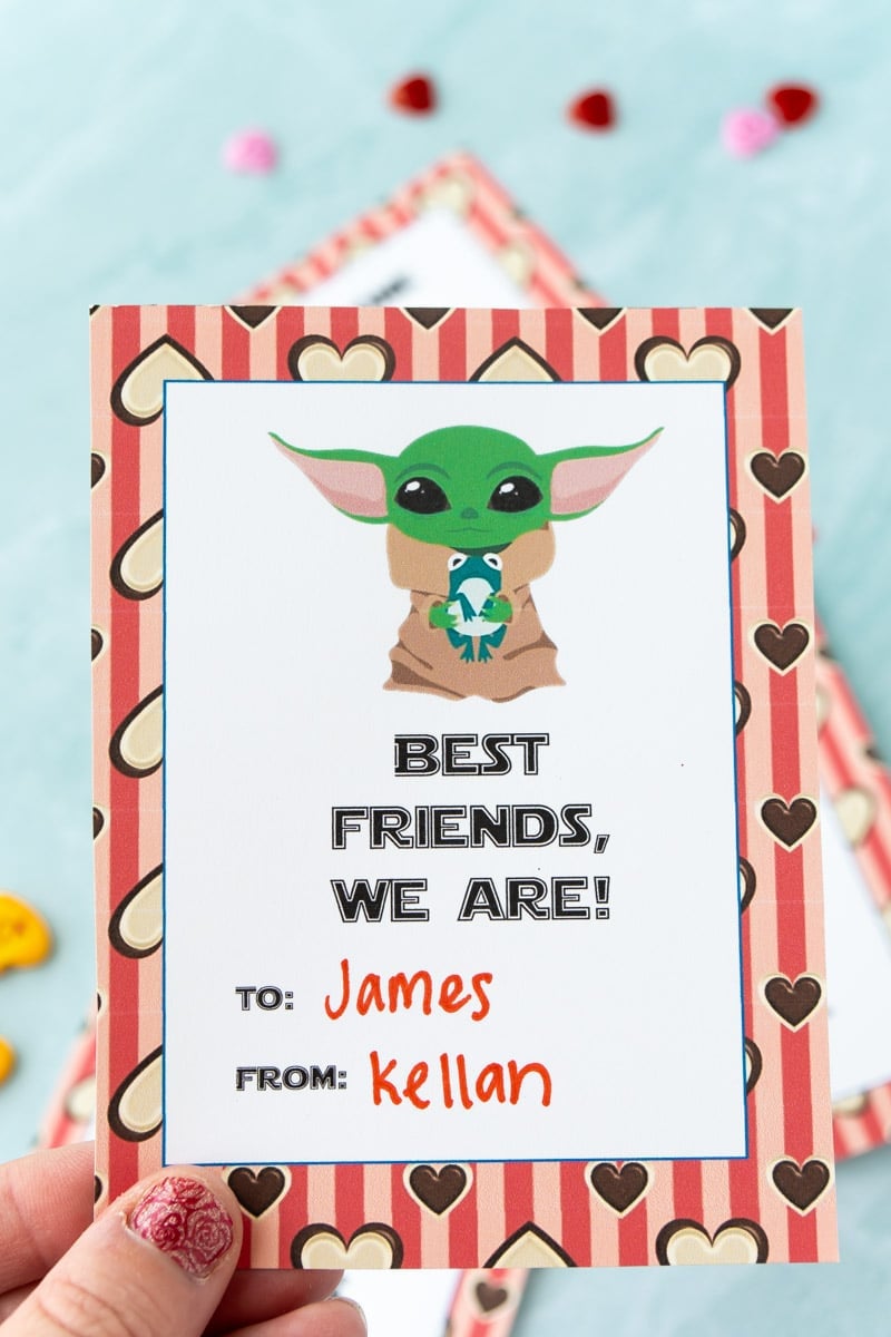 Baby Yoda valentines being held by someone