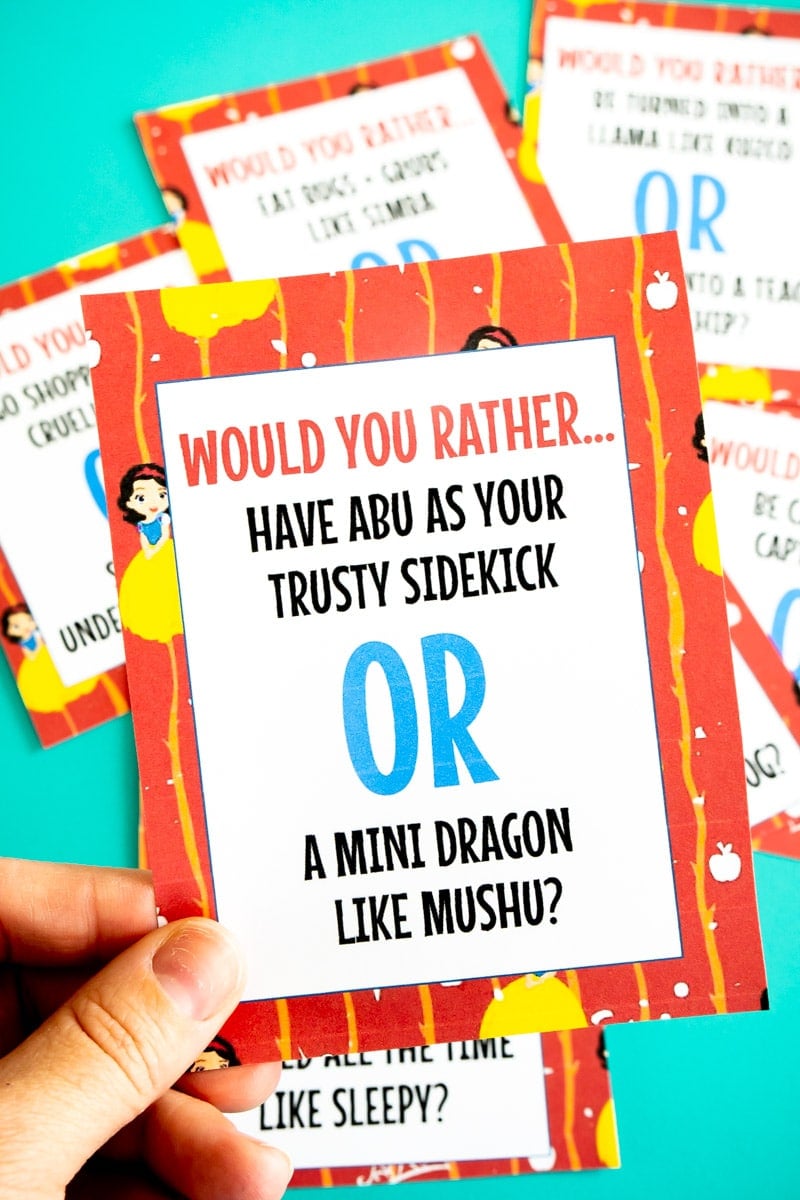 Someone holding Disney would you rather questions