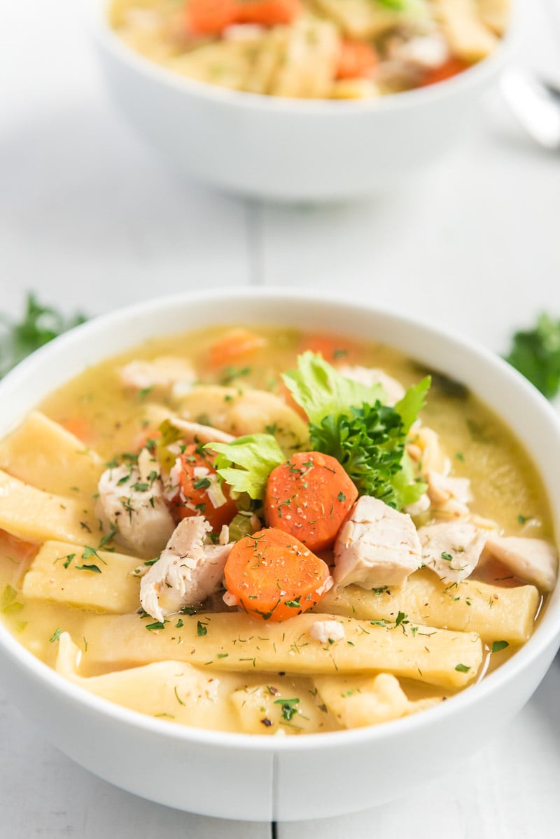 bowl of chicken noodle soup with homemade egg noodles