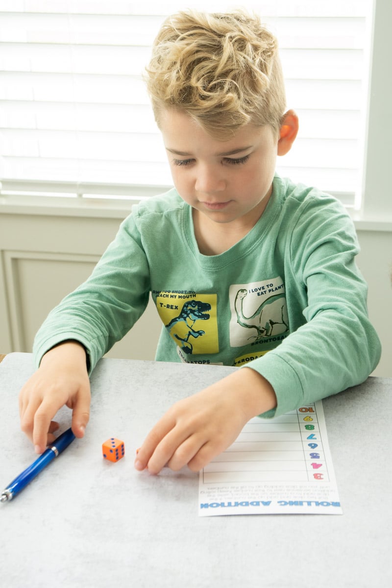 Kid playing math dice games