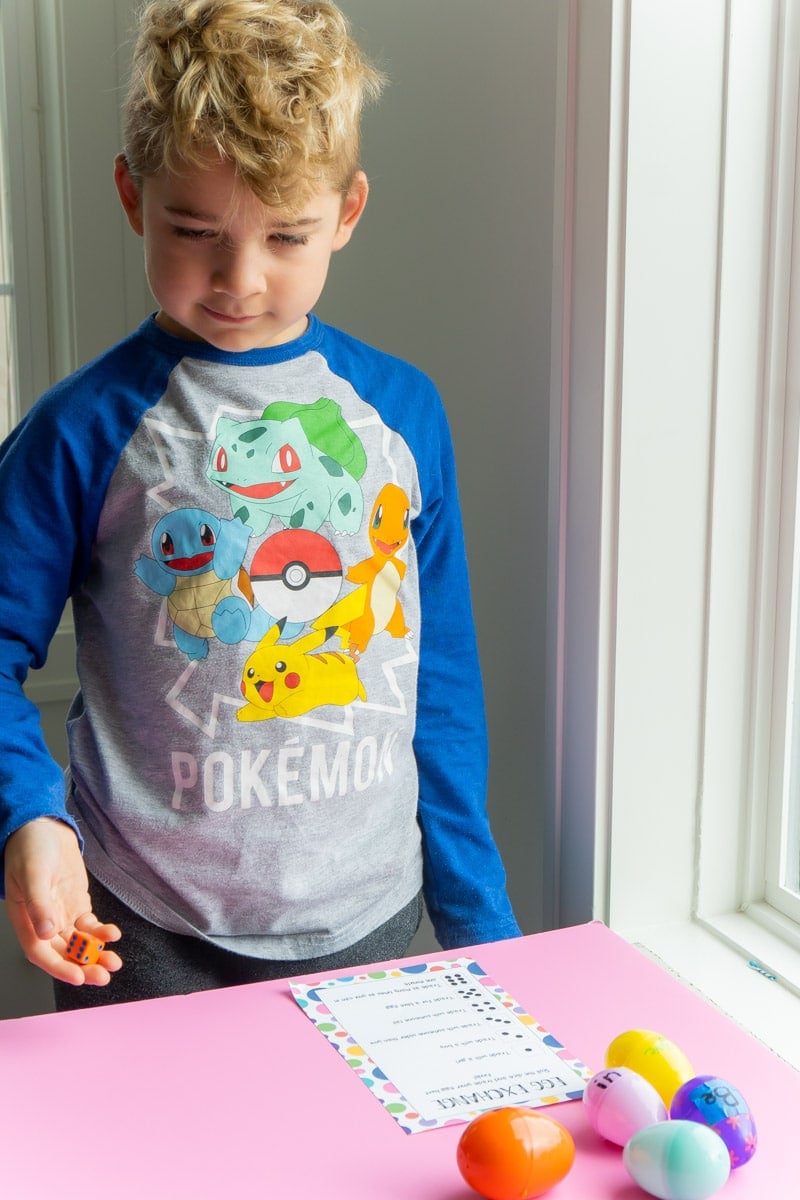 Kid playing Easter dice game