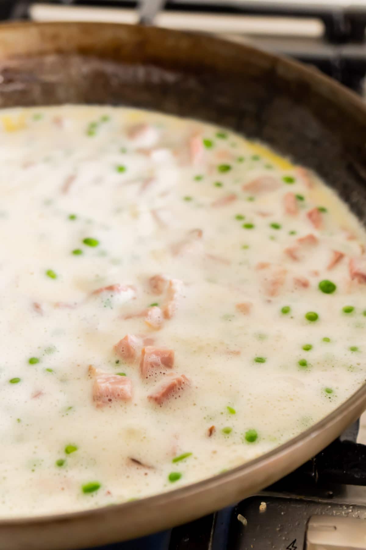 Creamy garlic butter sauce cooking in pan