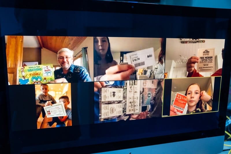 People holding coupons during virtual scavenger hunt