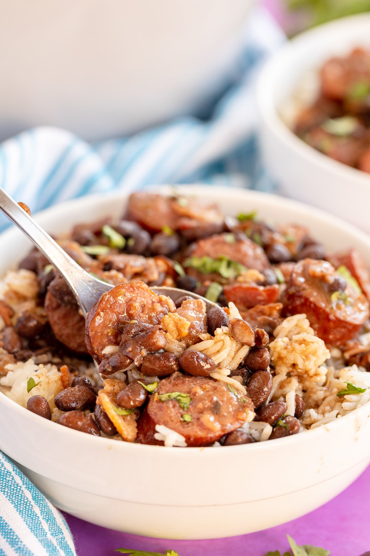 spoon in a dish of Brazilian feijoada