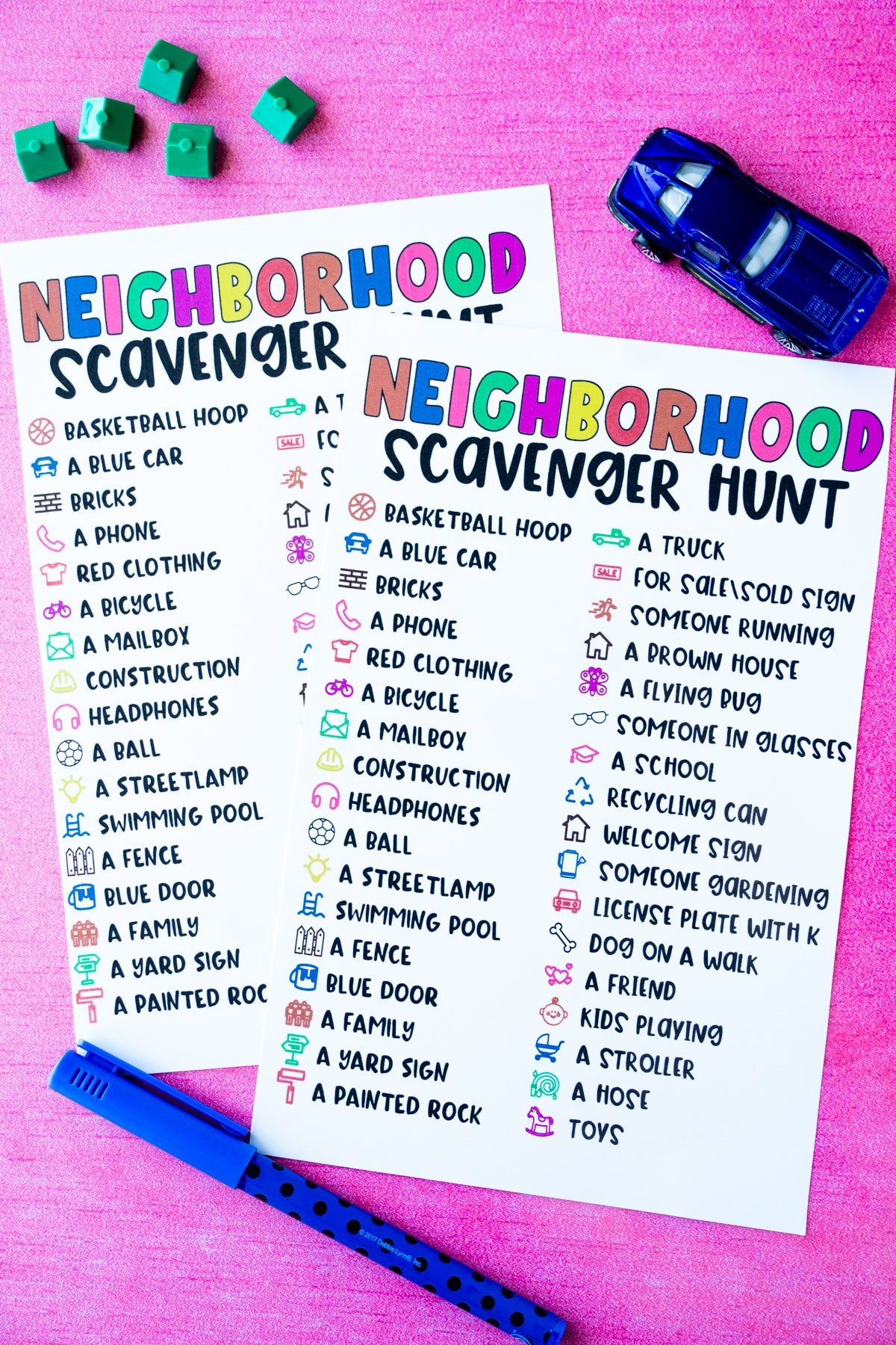 Two neighborhood scavenger hunt lists with toy houses