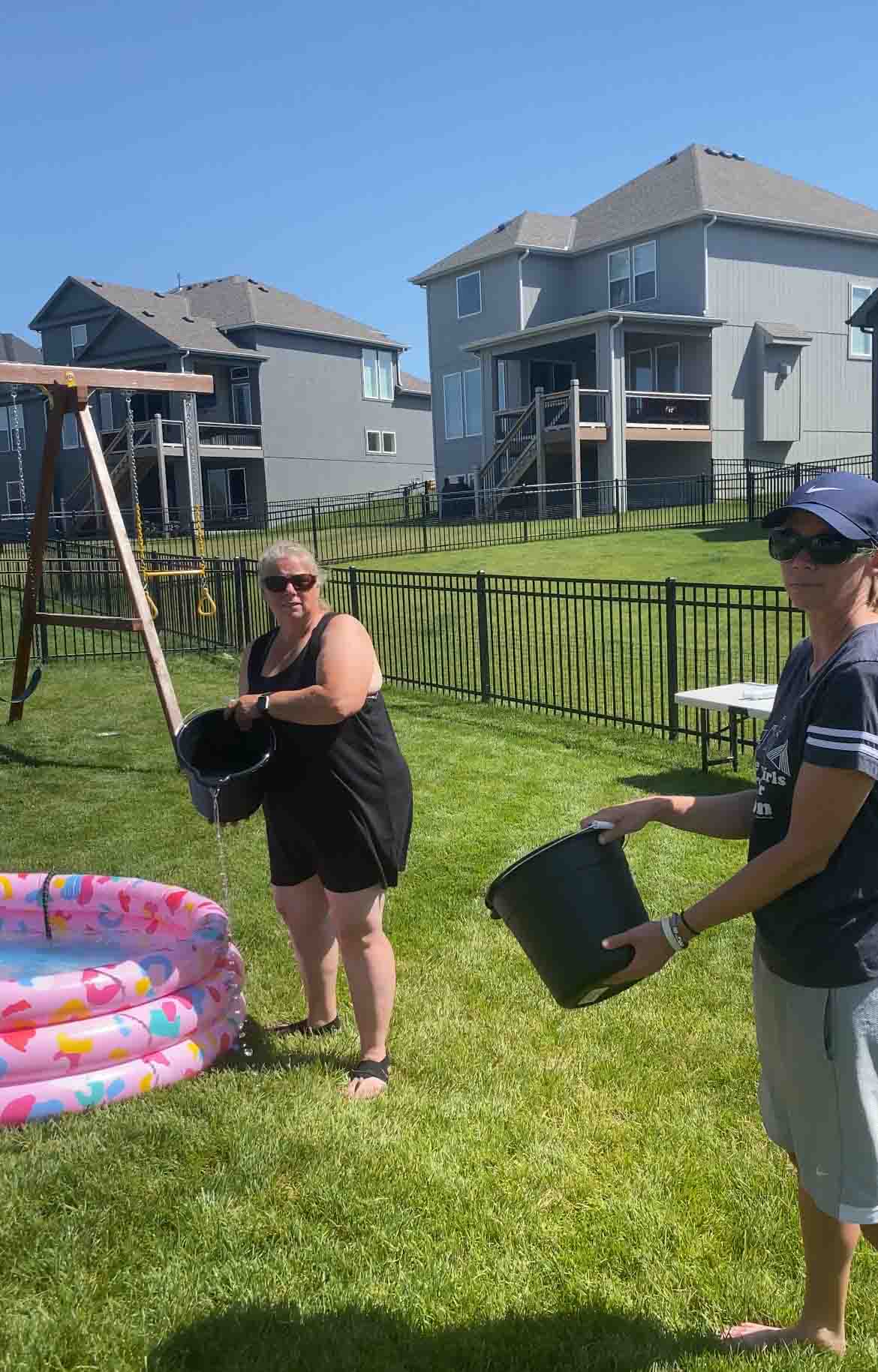 two women with buckets