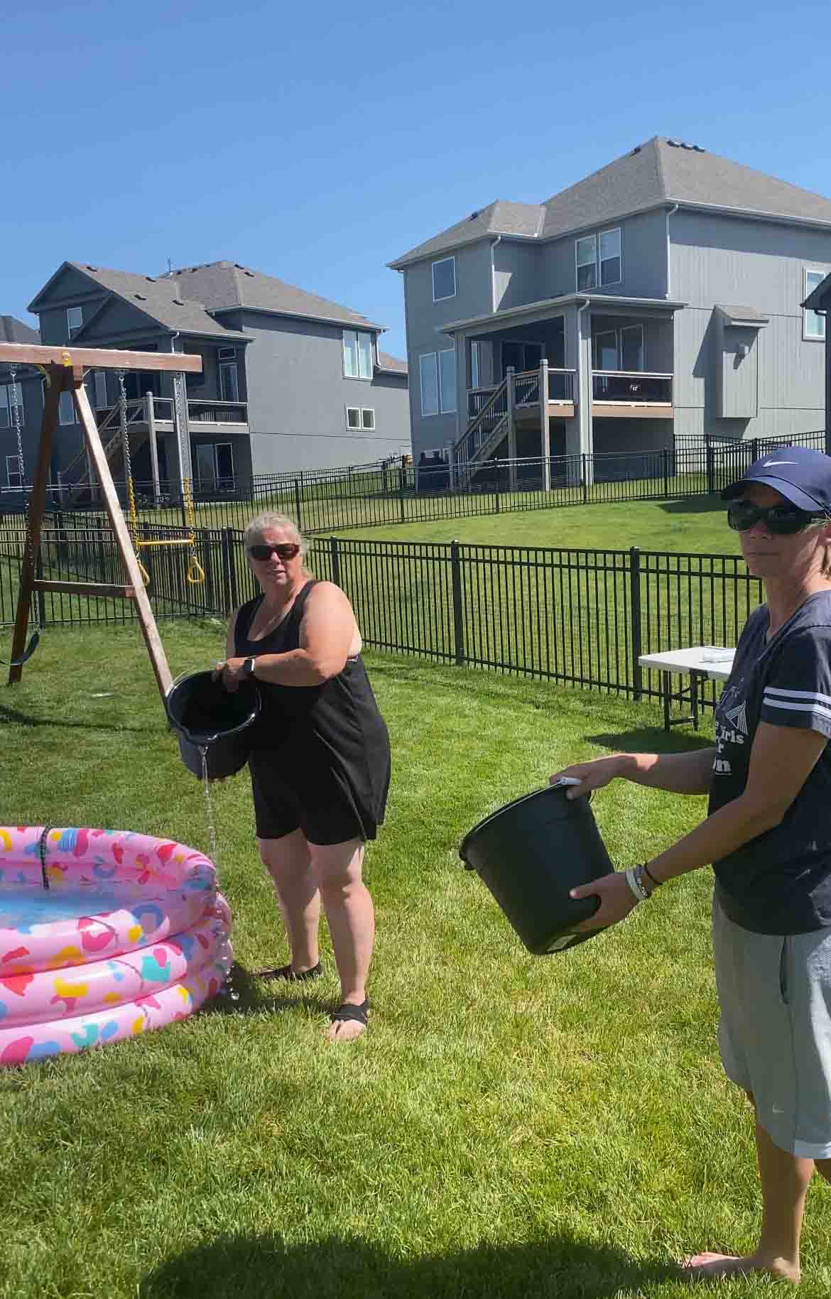 two women with buckets