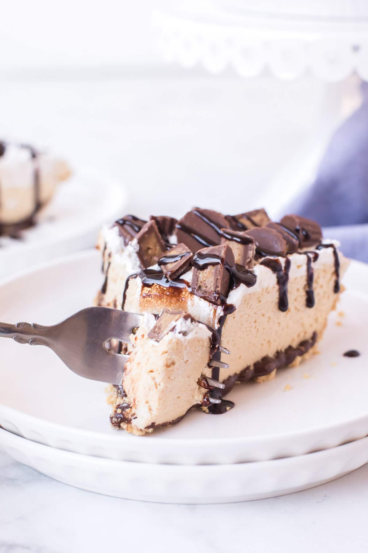 Peanut butter pie with a fork about to take a bite