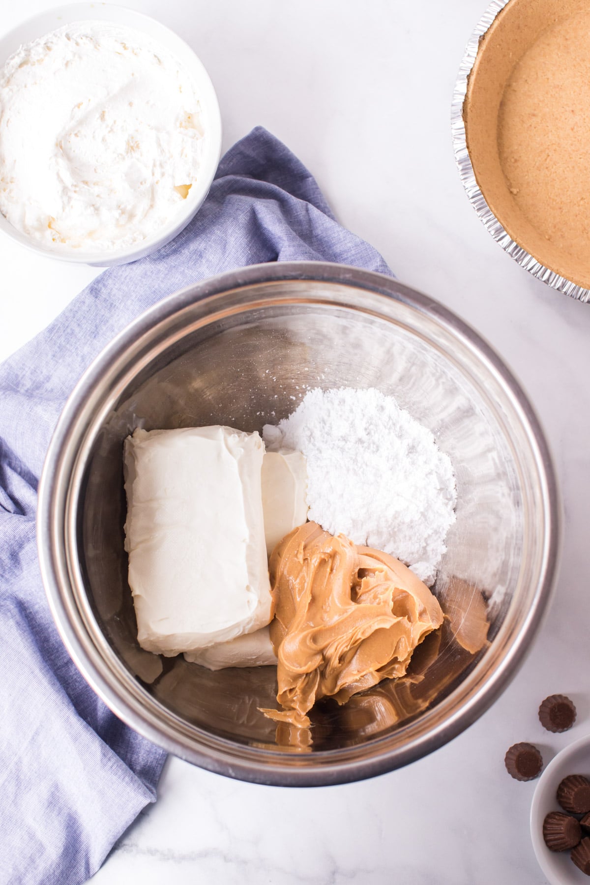 Ingredients for peanut butter pie filing in a metal bowl