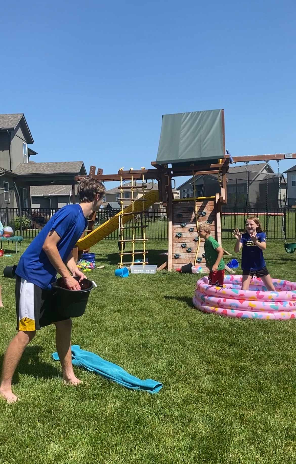 kids playing a game with a kiddie pool