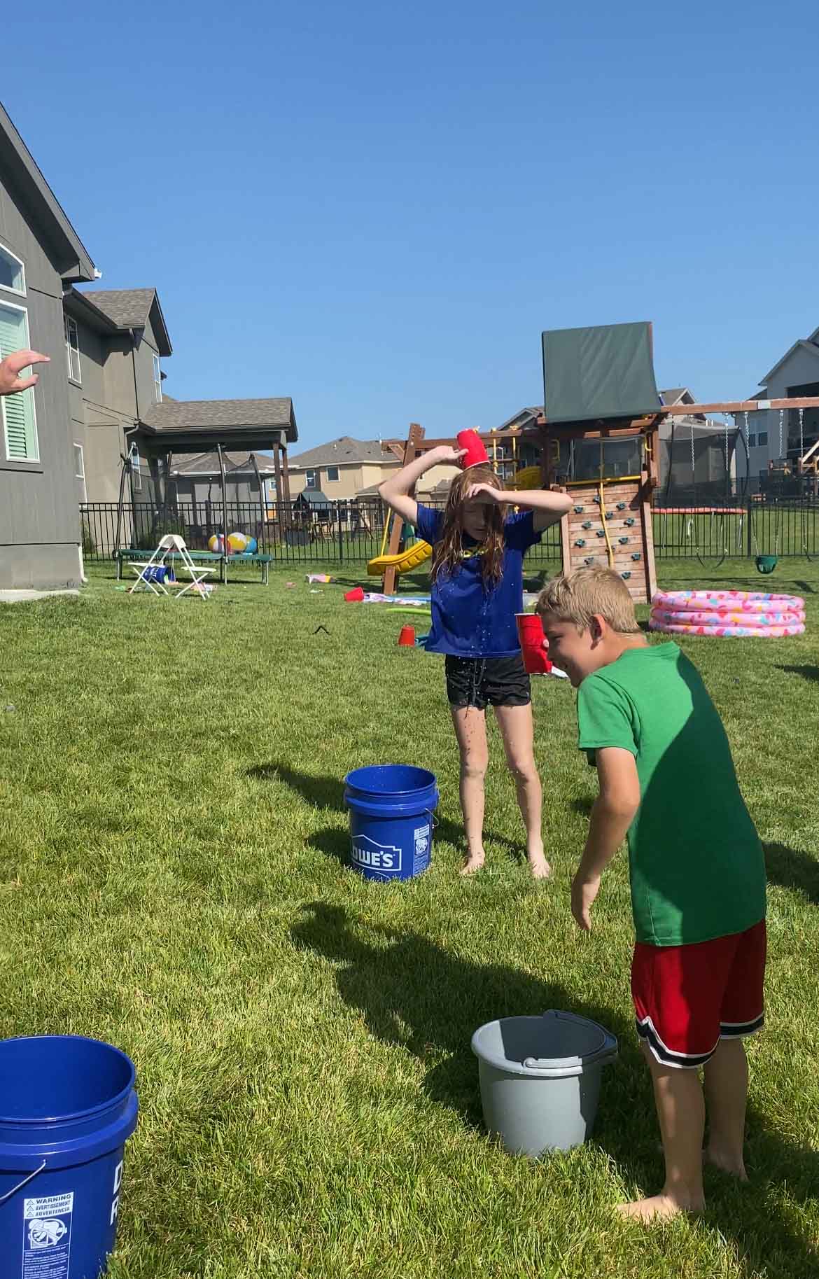 kids dumping water over their heads