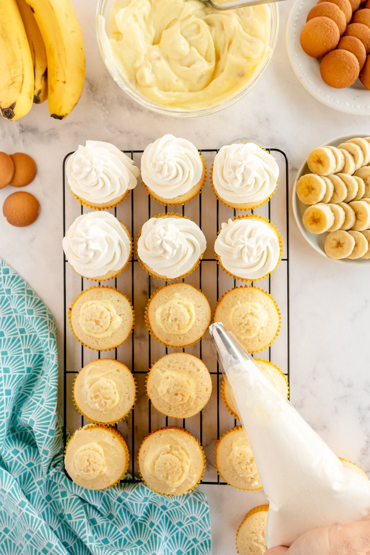 piping bag being used to pipe whipped cream frosting 