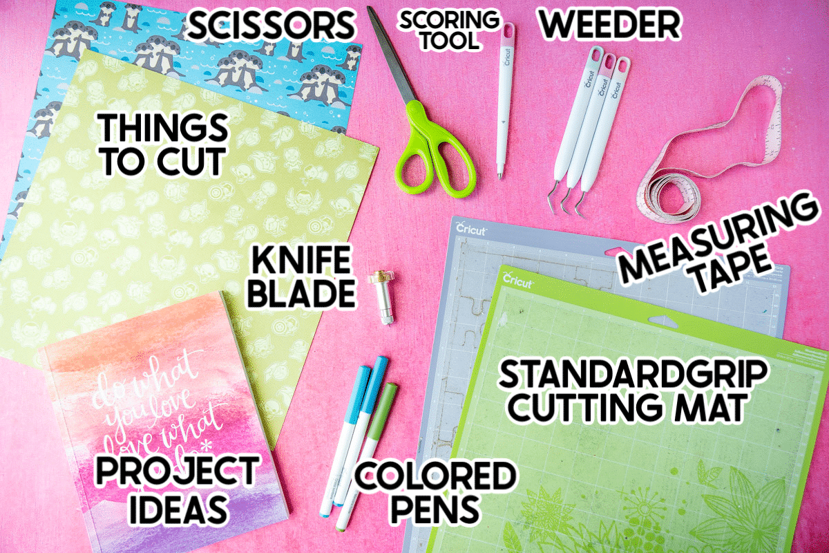 Flat lay photo with paper, scissors, measuring tape, and other tools