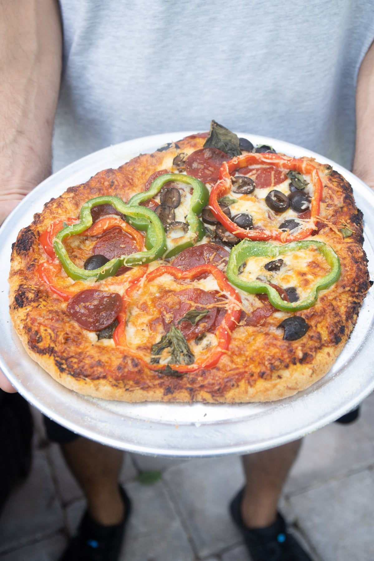 Pizza cooked in an outdoor brick oven