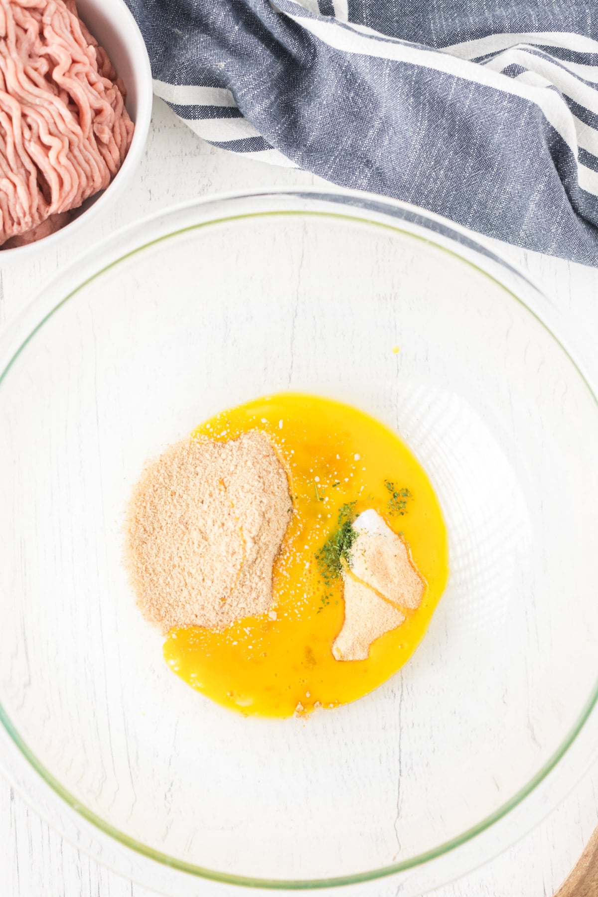 Egg and spices in a large glass bowl 