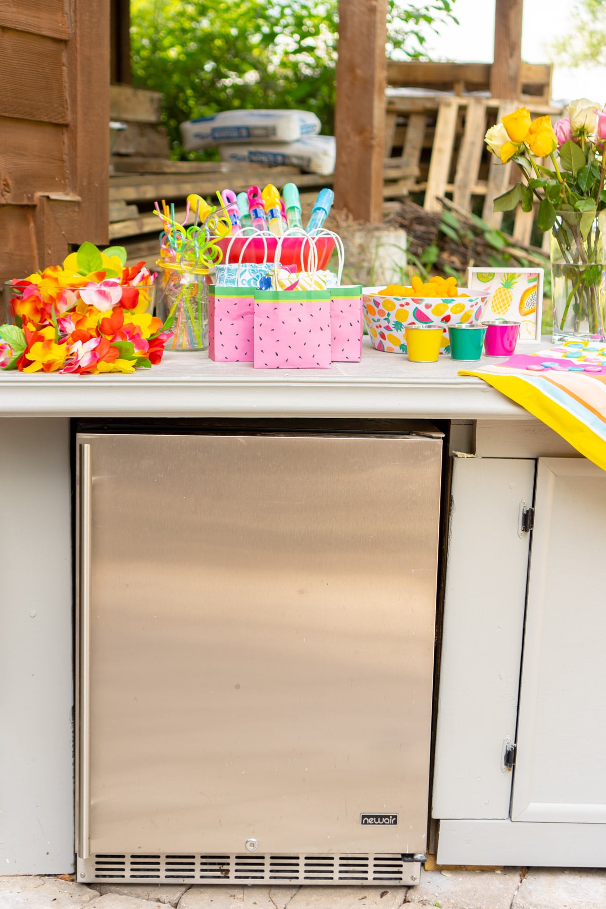 Newair beverage fridge and colorful party favors