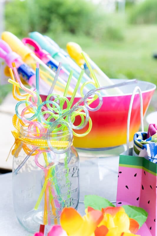 Crazy straws in a glass mason jar