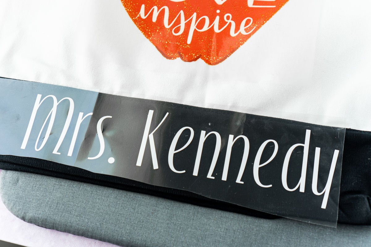 Mrs. Kennedy in vinyl on the bottom of a tote bag