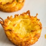 Three hash brown cups sitting on a white table