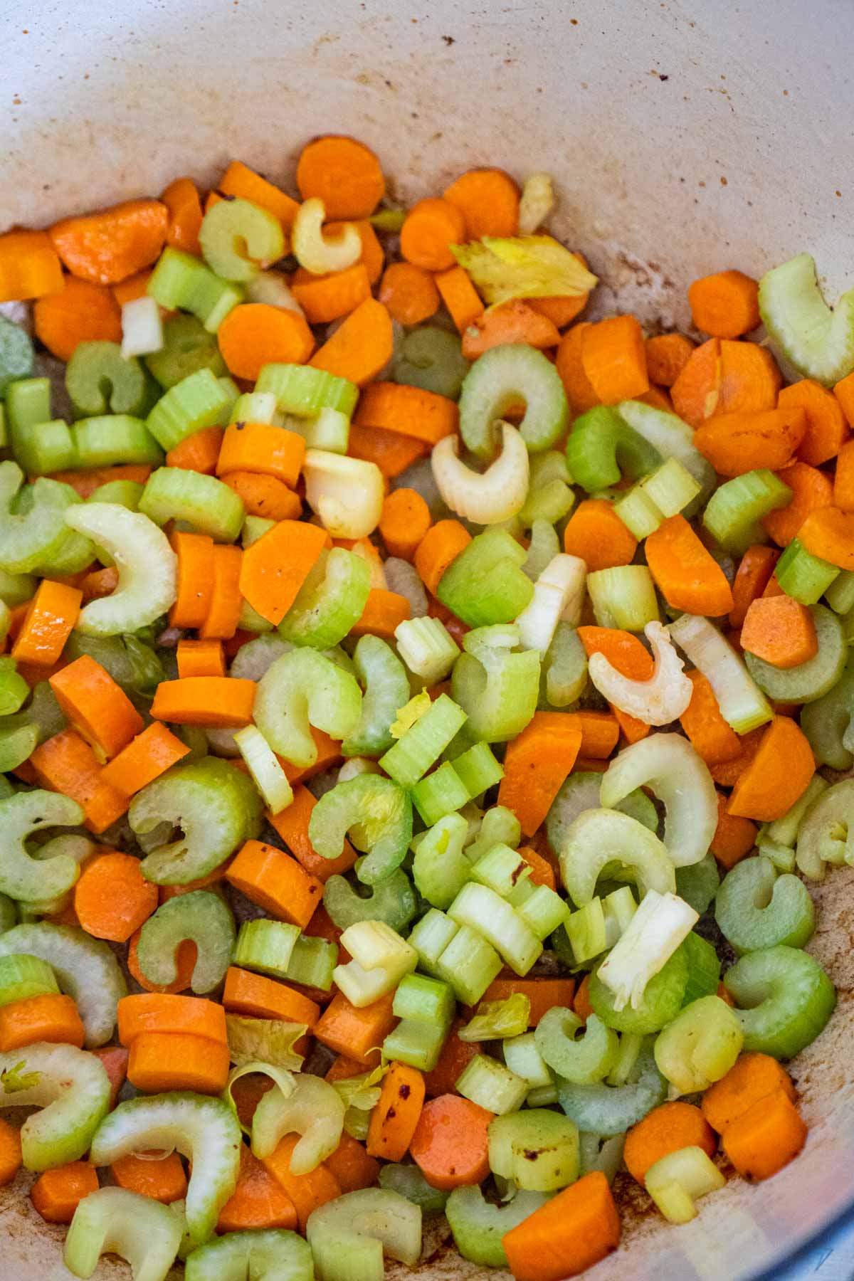 Celery and carrots in a large soup pot