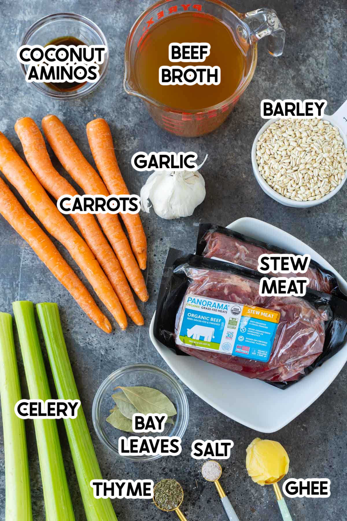 Carrots, veggies, and other ingredients needed to make beef barley soup