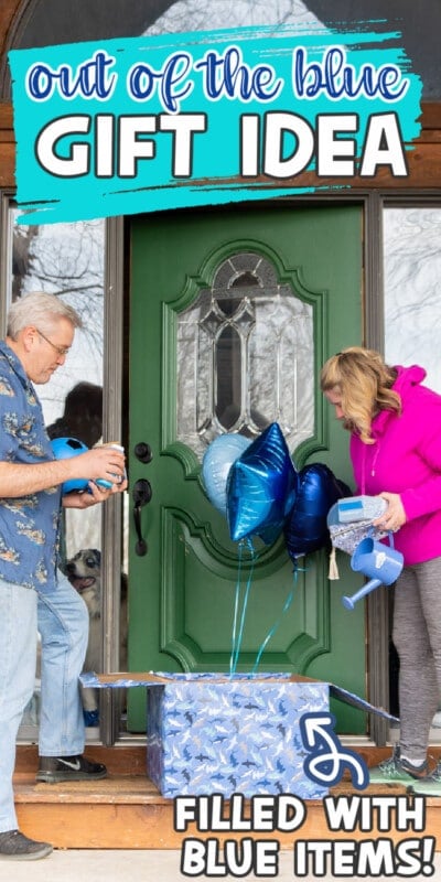 Two adults opening a wrapped gift box with blue balloons