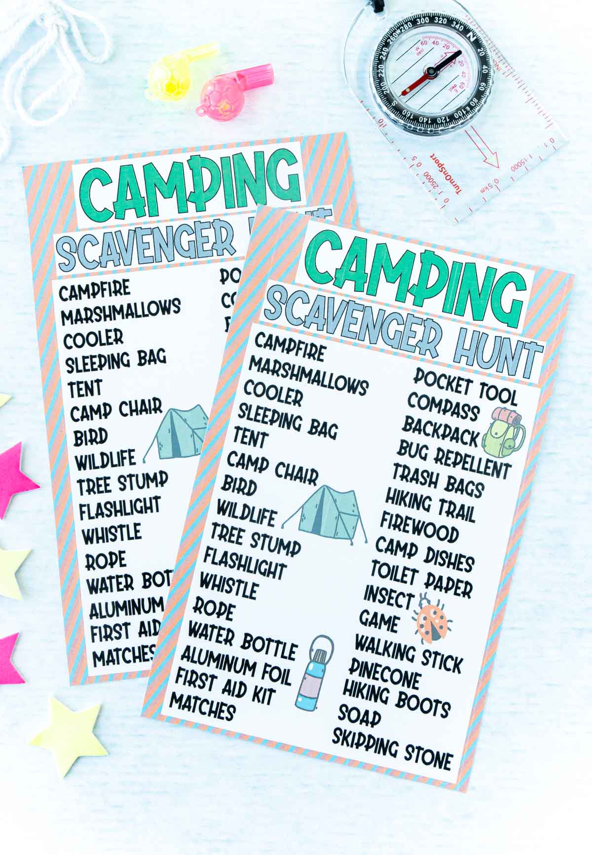 two copies of a camping scavenger hunt with a toy compass and whistle on a light blue background