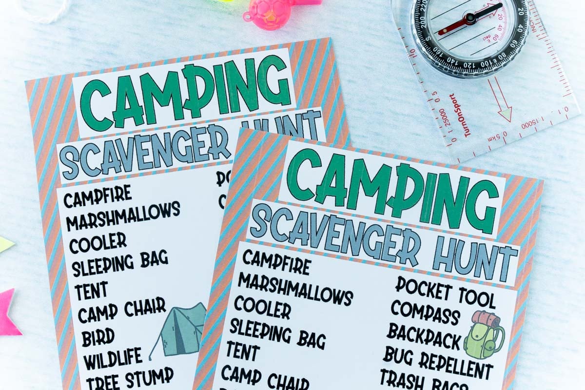 two copies of a camping scavenger hunt with a toy compass and whistle on a light blue background