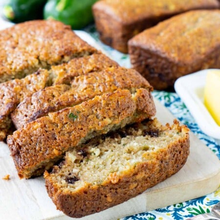 Top down view of sliced chocolate chip zucchini bread on a cutting board