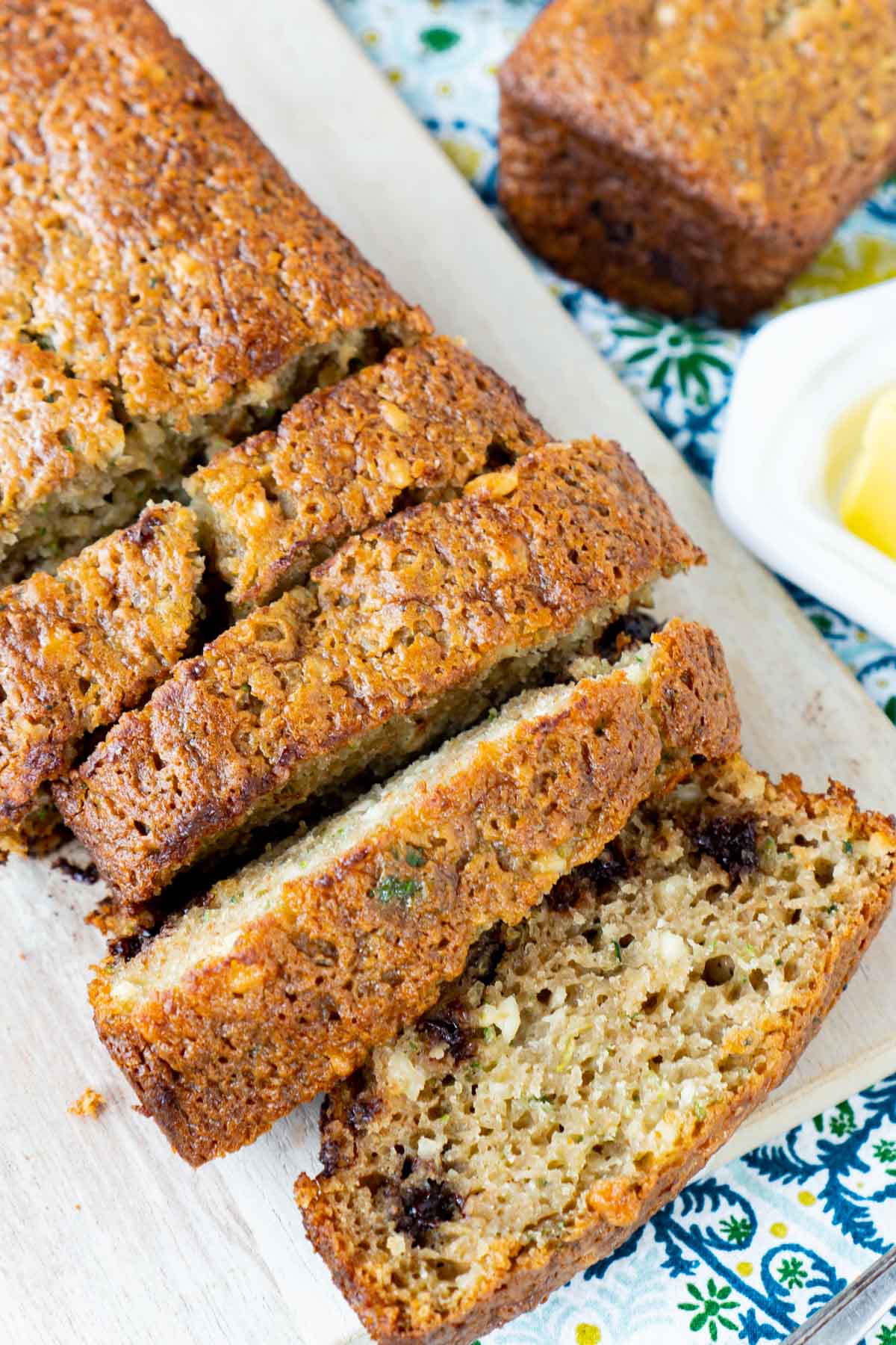 Top down view of sliced chocolate chip zucchini bread on a cutting board