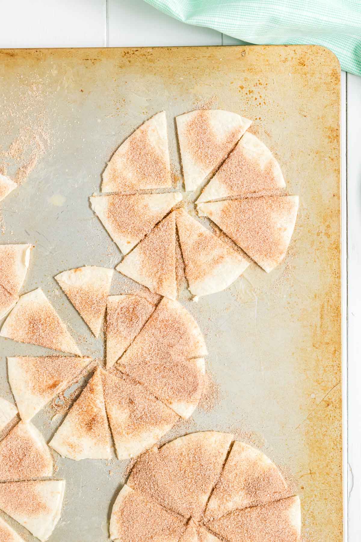 Tortillas cut into triangles and covered in cinnamon sugar