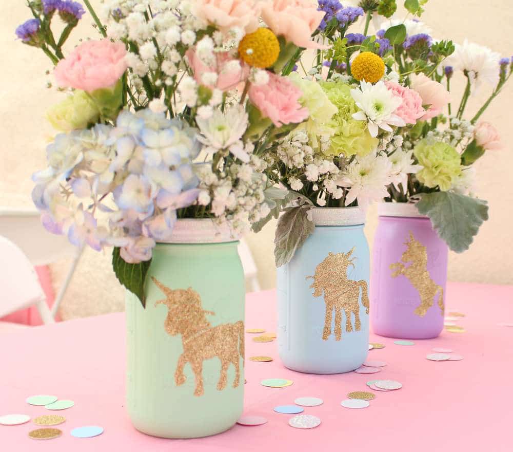 unicorn print vases with flowers in them