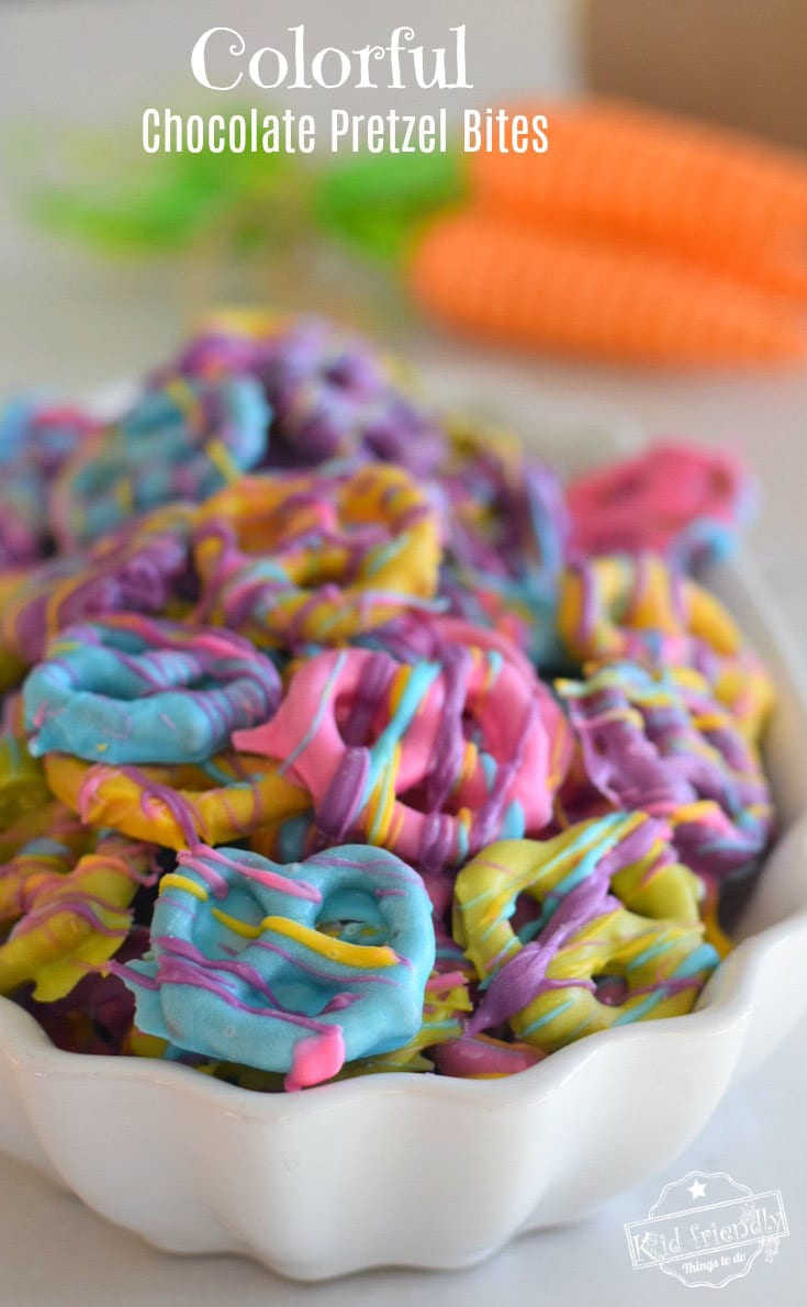 Pretzels in a bowl covered with rainbow colored chocolate