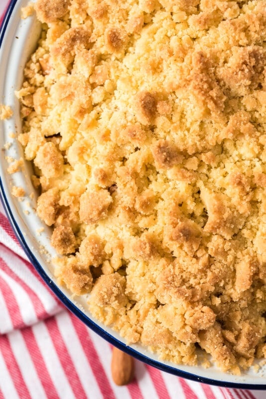 Baking dish with apple crumble and a red napkin