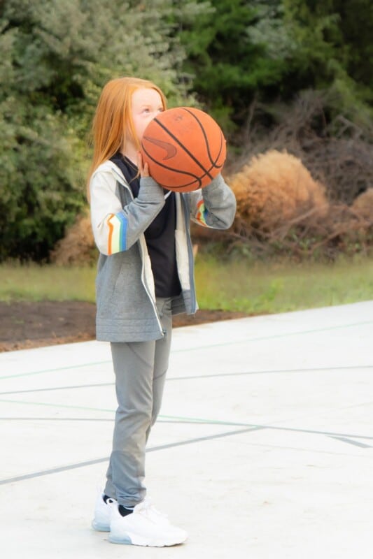 Girl holding a Nike basketball