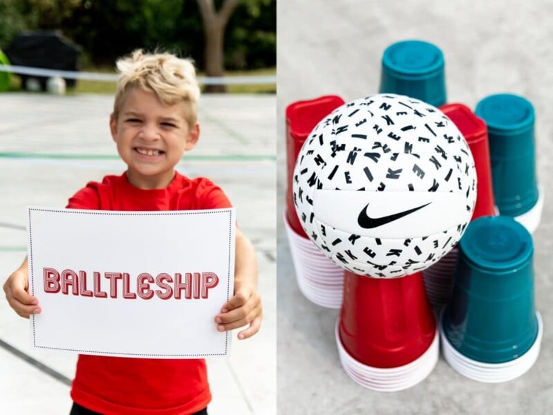 Kid holding sign that says balltleship and a bunch of plastic cups