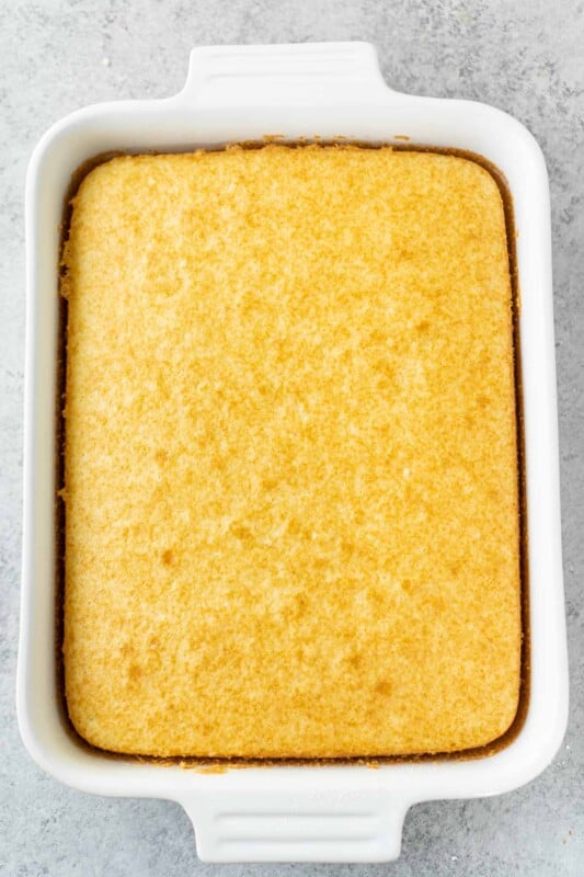 White cake in a white rectangle dish