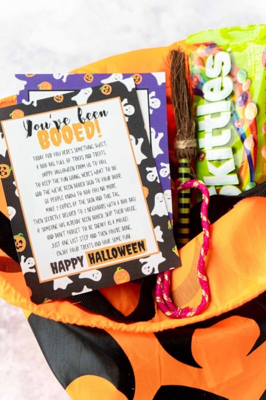 You've been booed sign on a pumpkin bag with Halloween candy