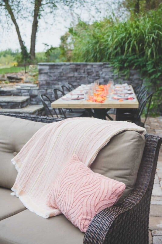 Blankets on a couch in an outdoor entertaining area