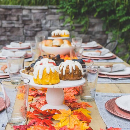 Fall table with fall colored bundt cakes