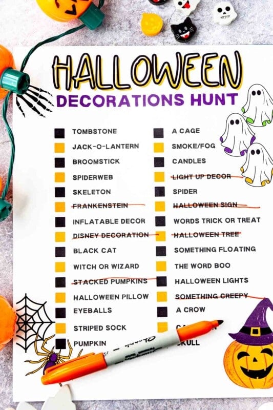 Printed out Halloween decorations hunt with Halloween items all around