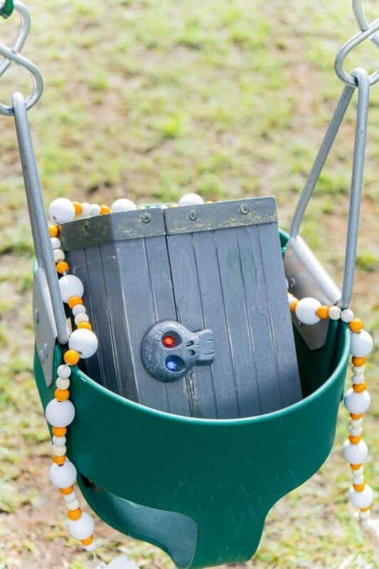 Treasure chest in a baby swing
