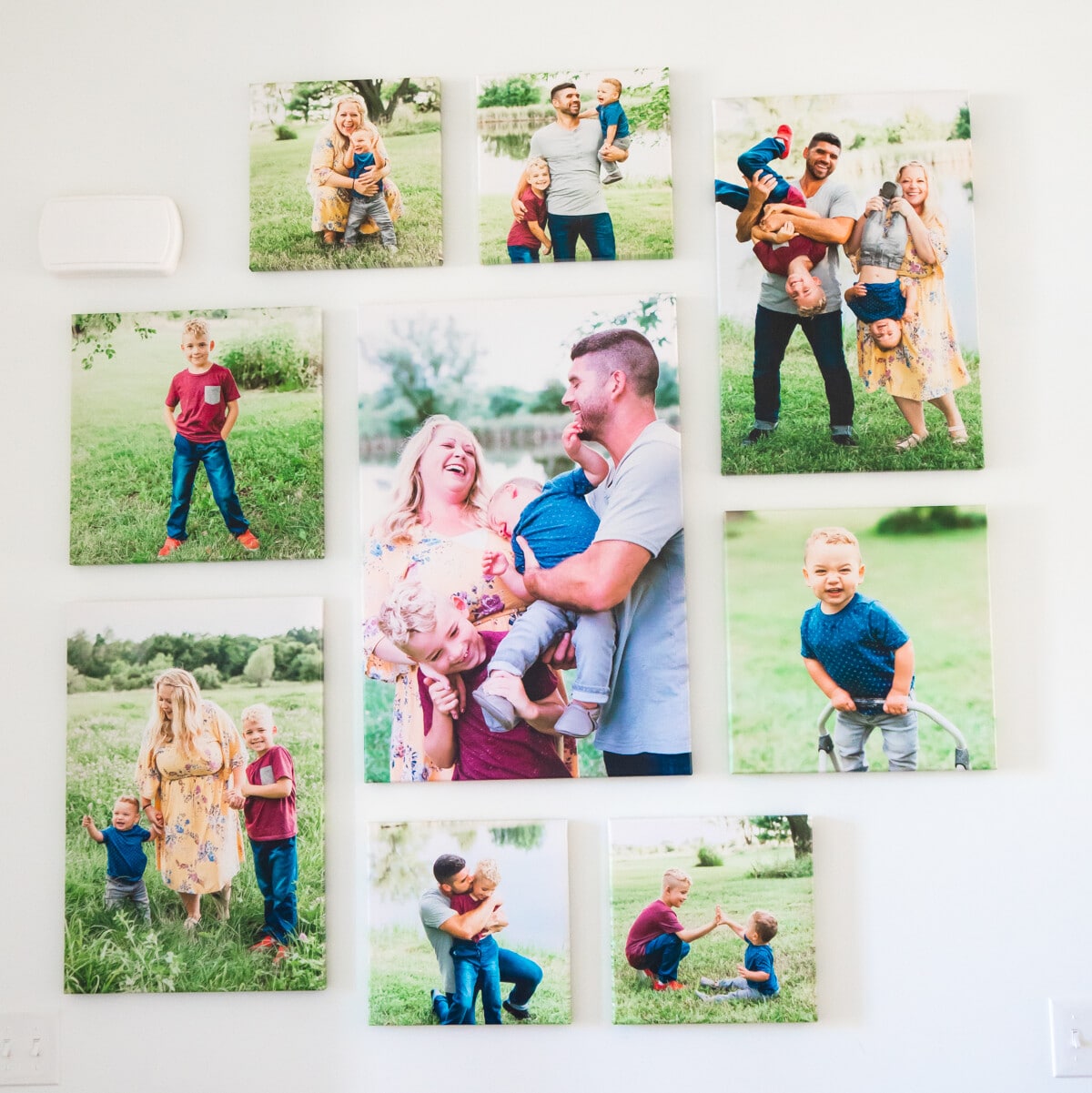 Family photos on canvases on a wall