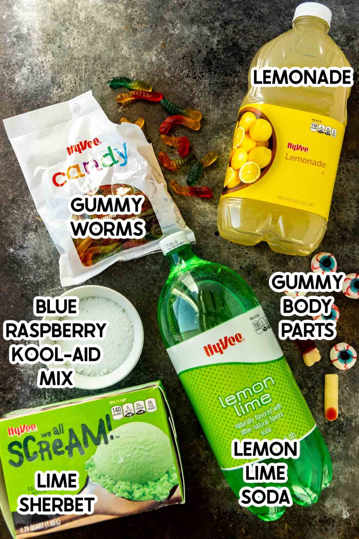 Drinks and other ingredients for a Halloween punch with labels