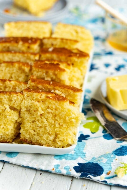 A white rectangle tray with pieces of sweet cornbread