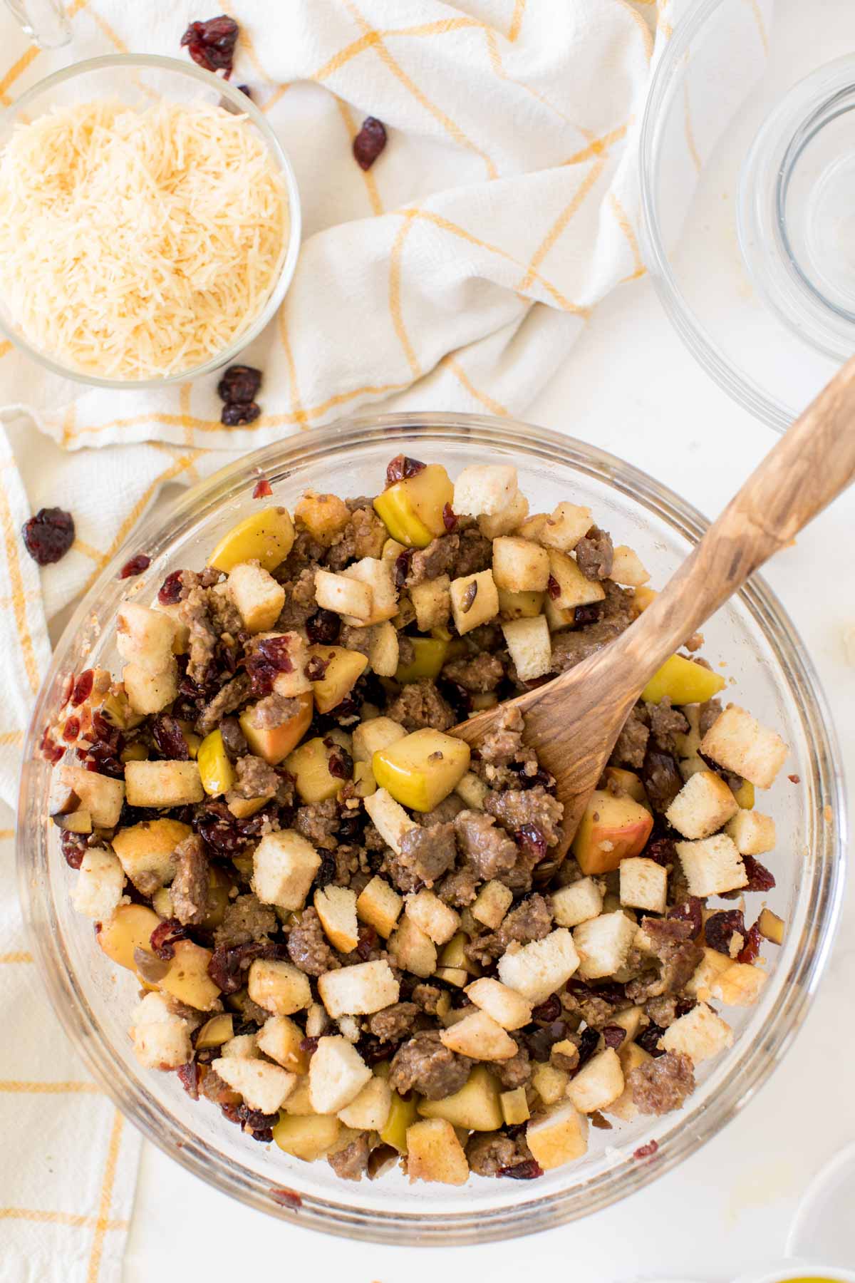 Ingredients for sausage stuffing in a large glass bowl