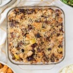 Top view of a glass baking dish full of sausage stuffing