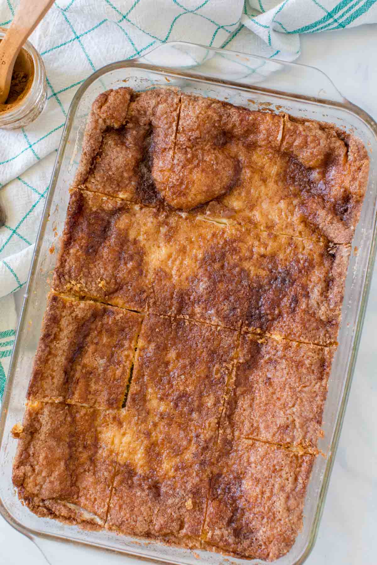 Sliced sopapilla cheesecake in a baking dish