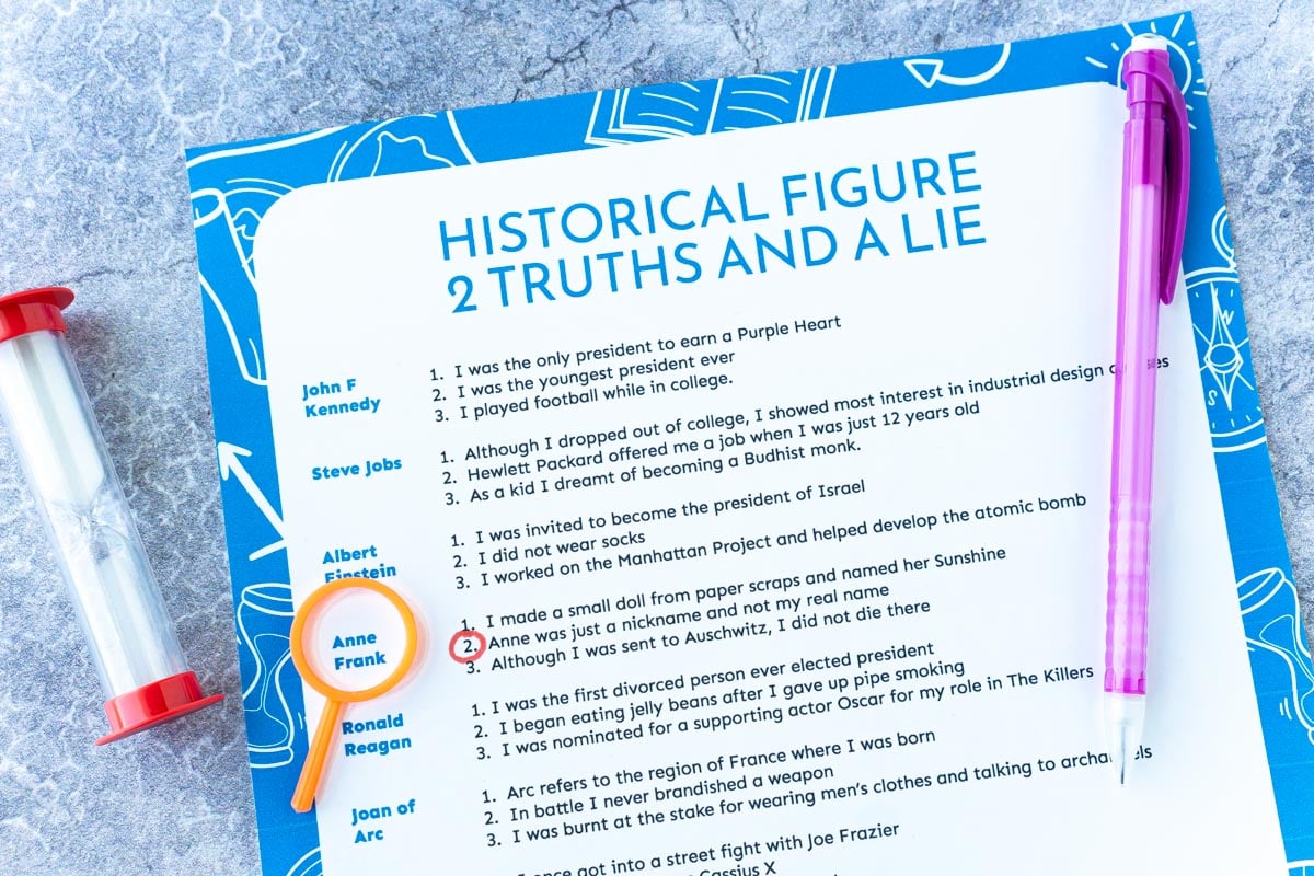 Printed out historical two truths and a lie game with a sand timer