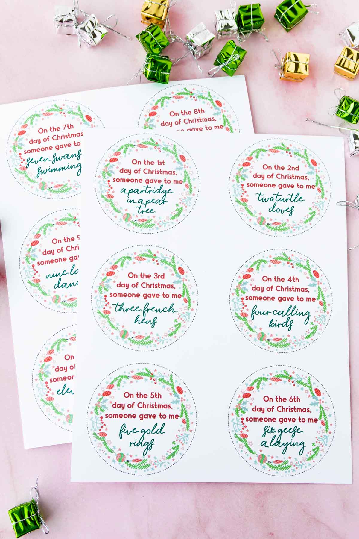 Tags for 12 days of Christmas gifts on a pink background